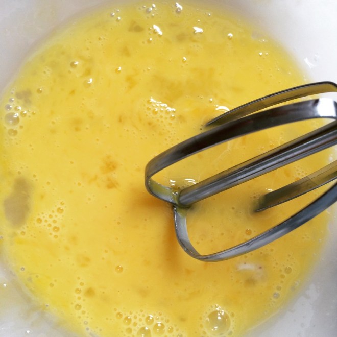 In a separate bowl, beat the egg and then mix in the milk and melted butter.